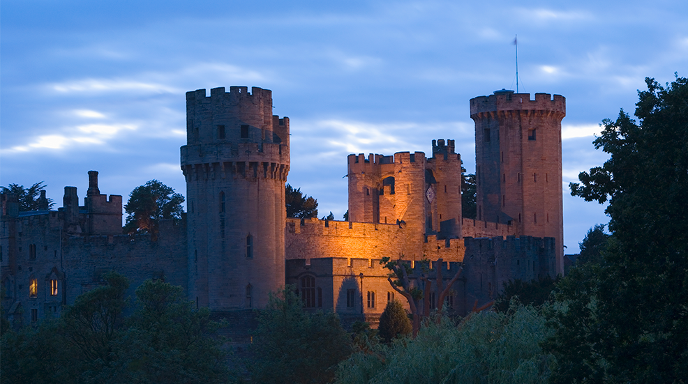 Dusk over Warwick Castle on the River Avon in Warwickshire